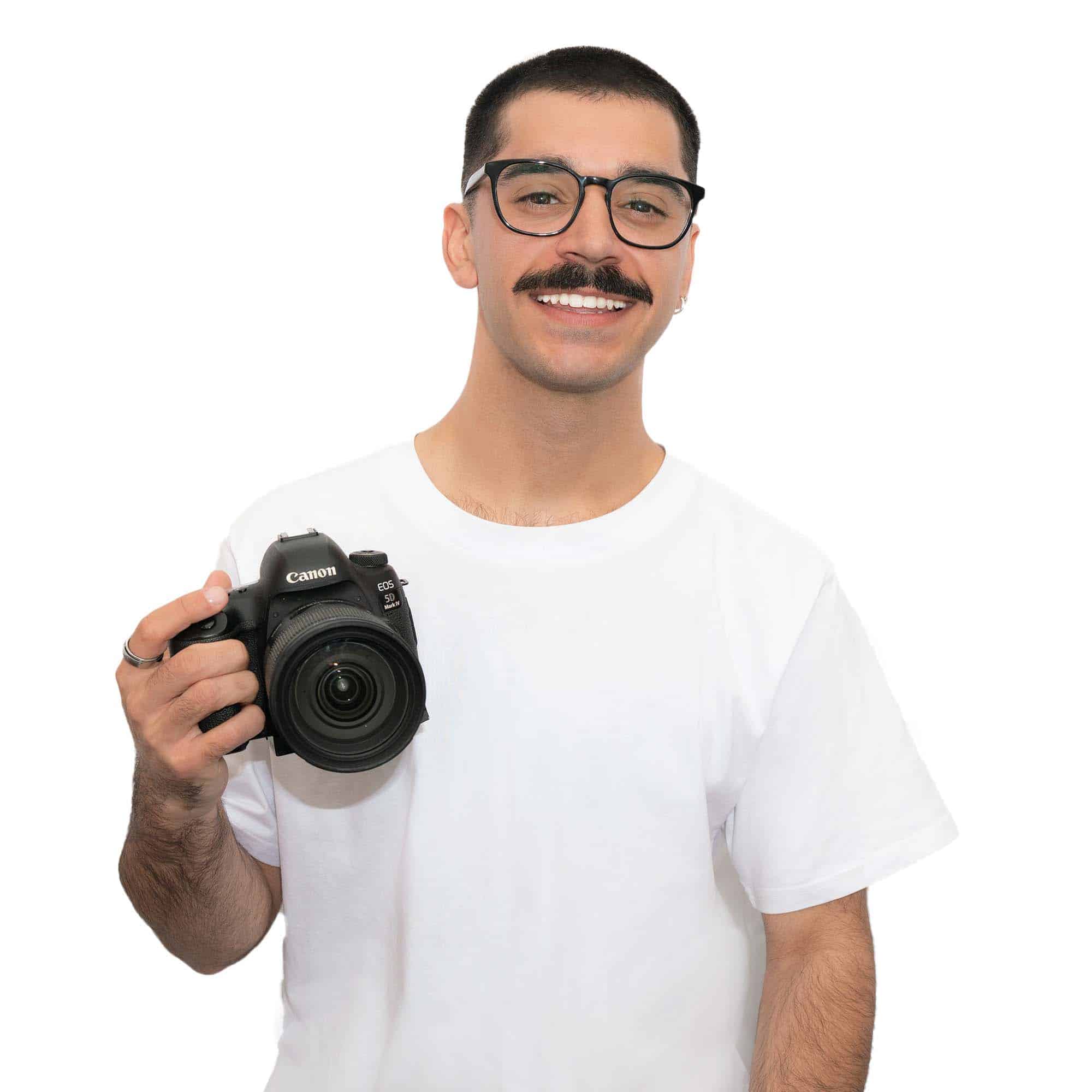 Photo of Alex holding a camera